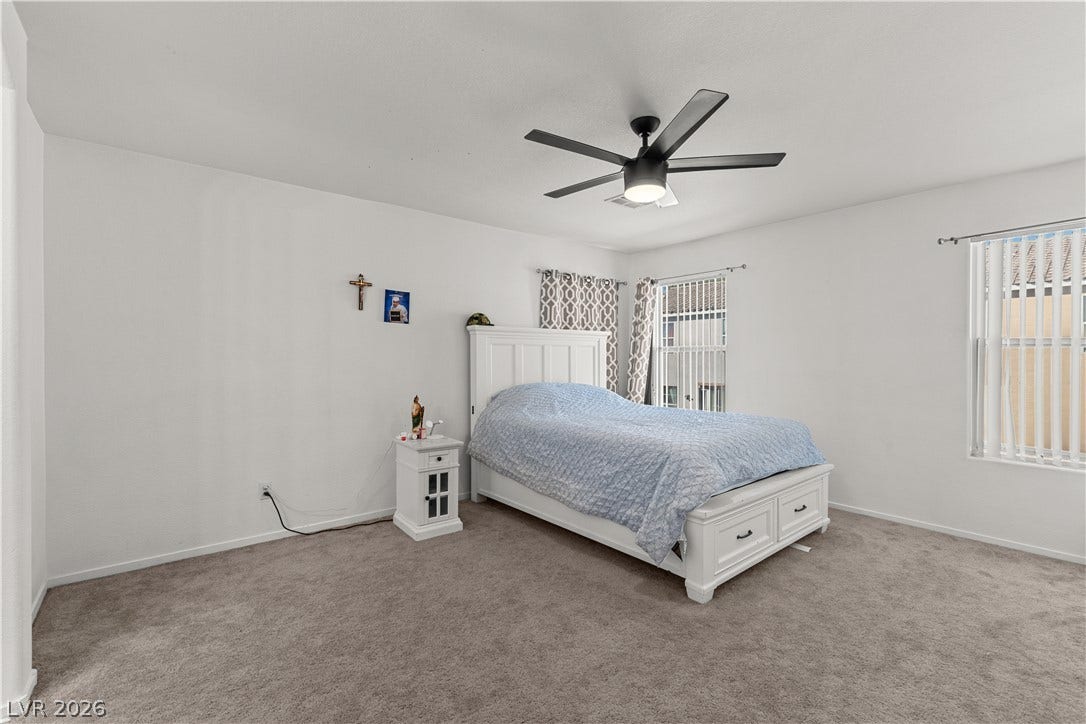 5015 Droubay Drive, Las Vegas, NV 89122 Plush carpeting and generous natural light define this comfortable, airy bedroom retreat.