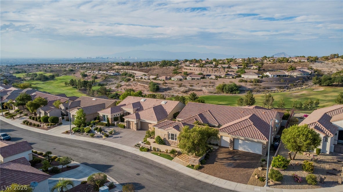 2734 Cherrydale Falls Drive, Henderson, NV 89052 Scenic neighborhood panoramas showcase a suburban setting alongside a golf course greensward.