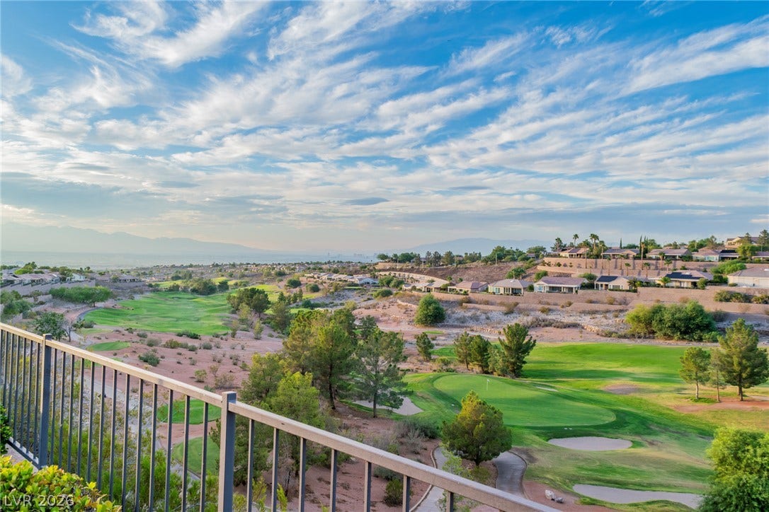 2734 Cherrydale Falls Drive, Henderson, NV 89052 Sweeping panoramic vistas of the rolling green fairways stretch toward the distant mountains.