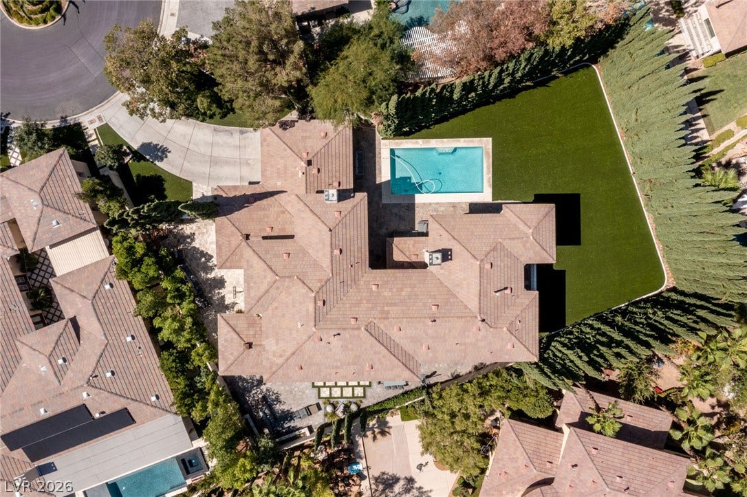 204 Satin Mist Court, Las Vegas, NV 89144 An aerial perspective reveals a sprawling estate complete with a private pool and manicured lawn.