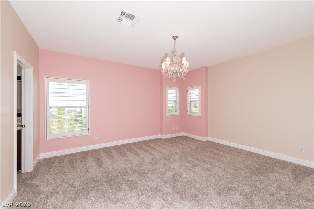 204 Satin Mist Court, Las Vegas, NV 89144 Plush carpeting and plantation shutters define this versatile upper-level room.
