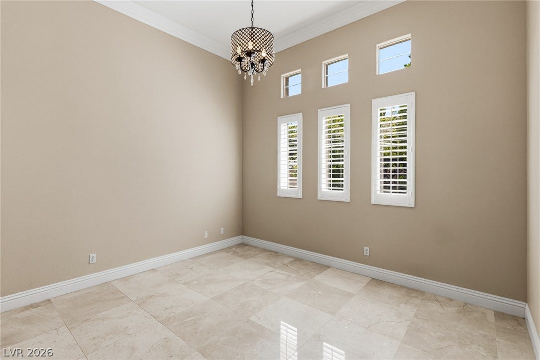 204 Satin Mist Court, Las Vegas, NV 89144 Gleaming tile floors and high ceilings with classic crown molding define this versatile interior space.