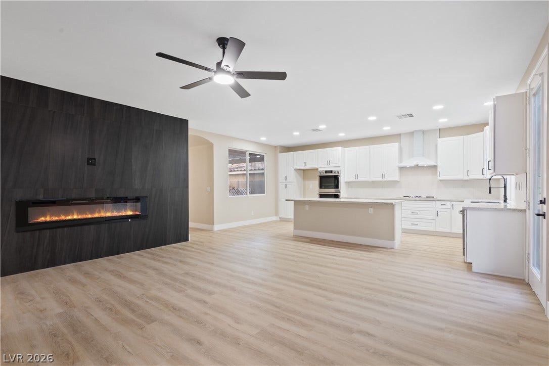 1662 Ravanusa Drive, Henderson, NV 89052 An open floorplan seamlessly connects the airy kitchen with a contemporary living space.