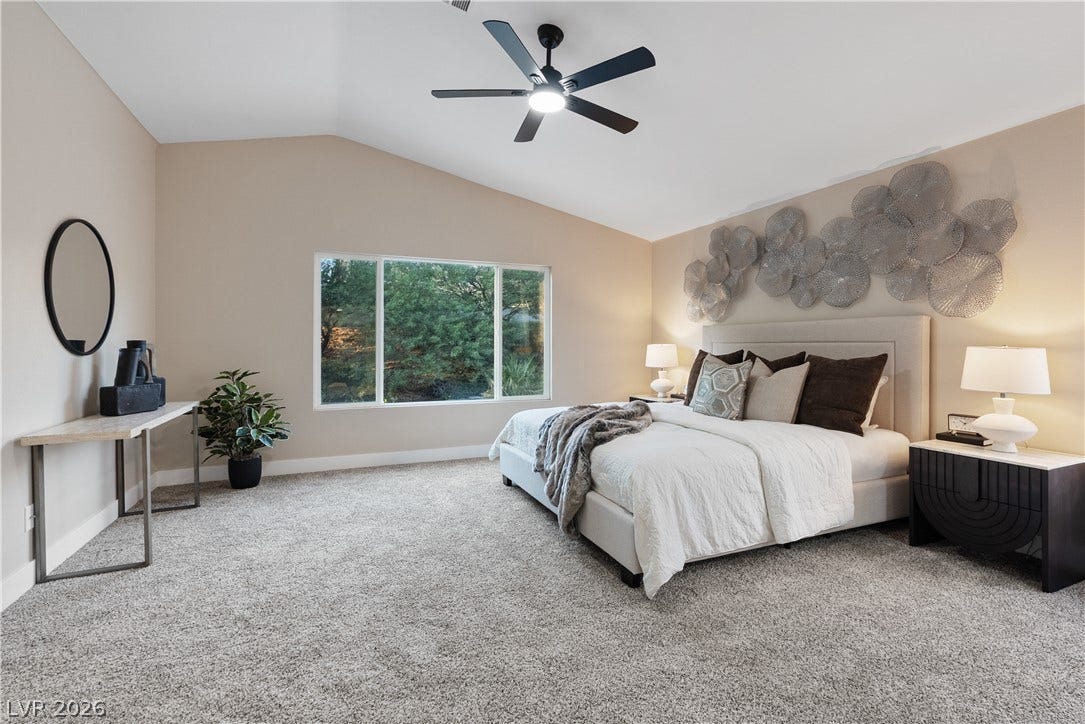 1662 Ravanusa Drive, Henderson, NV 89052 Vaulted ceilings and soft wall-to-wall carpeting define this peaceful sleeping space.