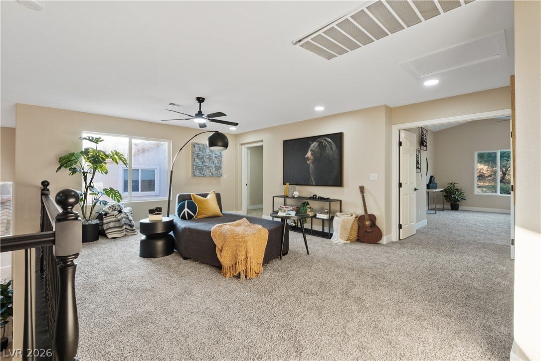 1662 Ravanusa Drive, Henderson, NV 89052 A spacious upper-level loft features wall-to-wall carpeting and recessed lighting.