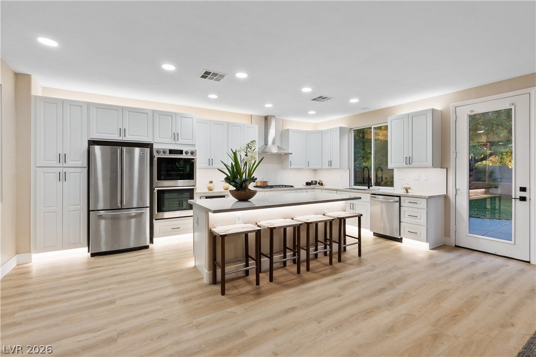 1662 Ravanusa Drive, Henderson, NV 89052 Smooth hard surface flooring anchors this modern culinary space featuring a large central island.