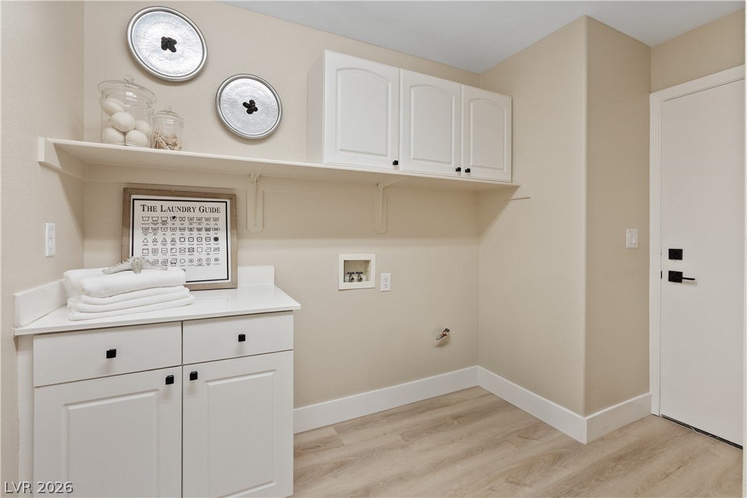 1662 Ravanusa Drive, Henderson, NV 89052 Ample built-in cabinetry and durable flooring define this highly functional utility space.
