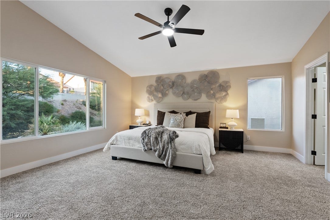 1662 Ravanusa Drive, Henderson, NV 89052 Vaulted ceilings and broad windows enhance this comfortable primary suite.