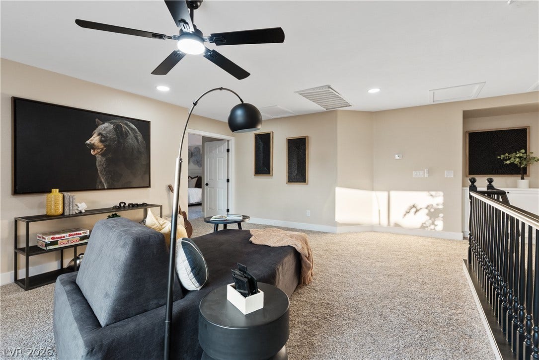 1662 Ravanusa Drive, Henderson, NV 89052 A spacious upper-level loft features wall-to-wall carpeting and soft recessed lighting.