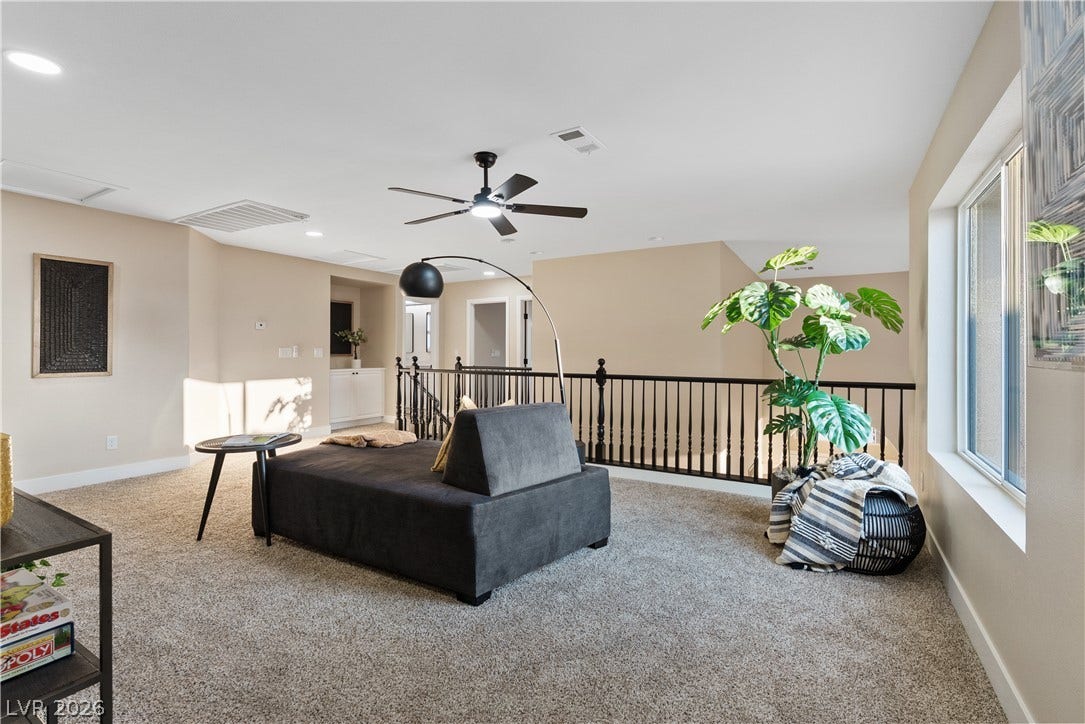 1662 Ravanusa Drive, Henderson, NV 89052 An open upstairs loft features wall-to-wall carpeting and overlooks the lower level.