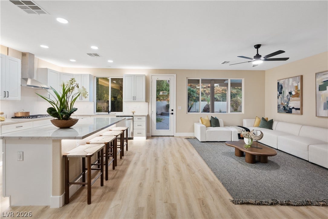 1662 Ravanusa Drive, Henderson, NV 89052 An open floorplan seamlessly connects the modern kitchen and inviting living space.