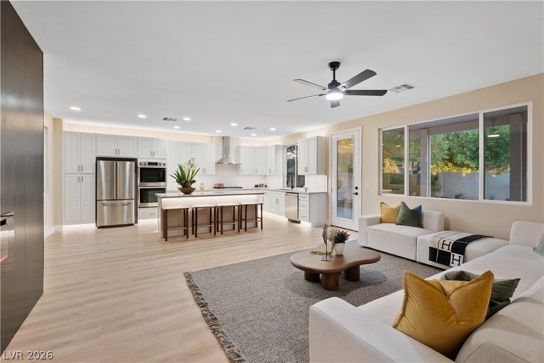 1662 Ravanusa Drive, Henderson, NV 89052 An open floorplan seamlessly connects the airy living area to a modern kitchen.