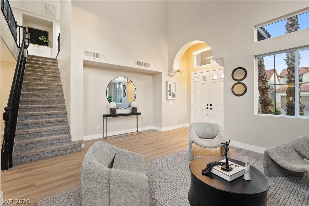 1662 Ravanusa Drive, Henderson, NV 89052 Towering ceilings and a prominent arched entryway define this light-filled reception area.