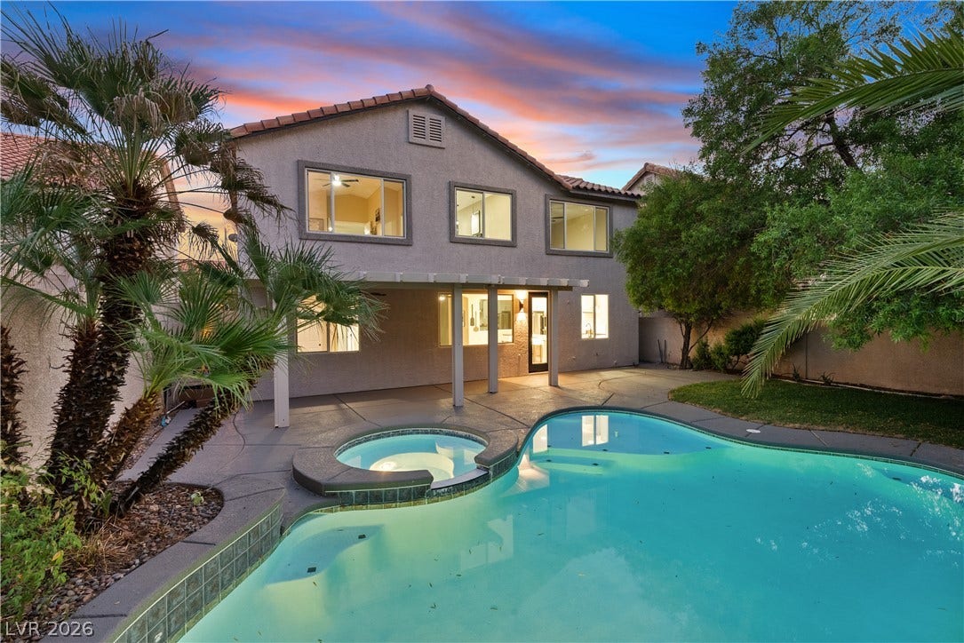 1662 Ravanusa Drive, Henderson, NV 89052 A sparkling swimming pool and integrated spa anchor this private, palm-fringed backyard retreat.