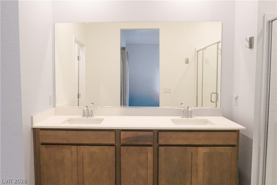 Clean lines and a spacious double vanity define this modern bathroom design.
