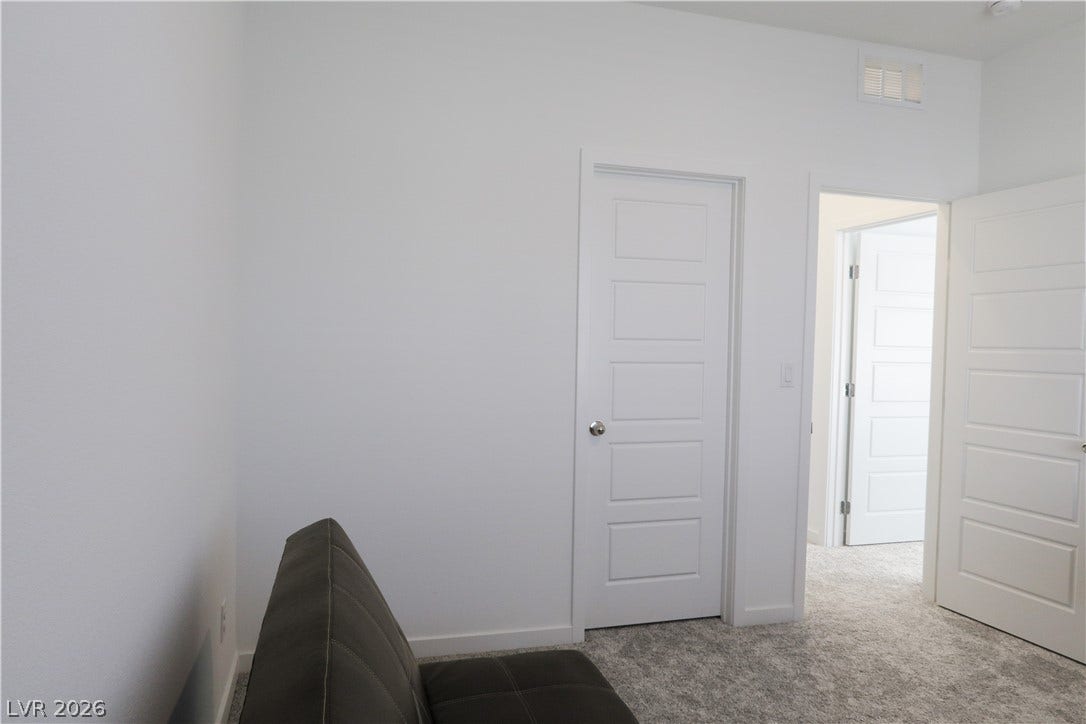 Clean lines and soft carpeting define this versatile interior space.