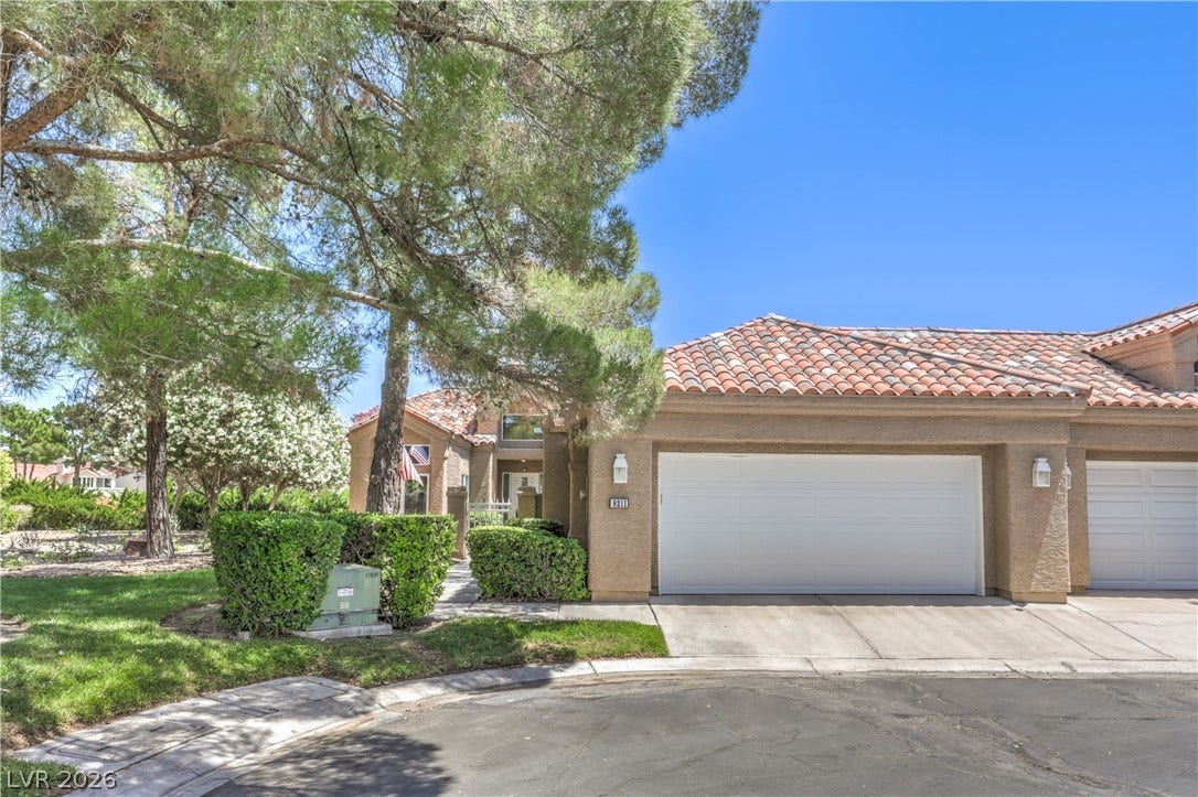 8211 Round Hills Circle, Las Vegas, NV 89113 Discover this residence featuring a tiled roof, attached garage, and mature landscaping for pleasant curb appeal.