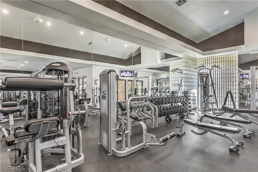8211 Round Hills Circle, Las Vegas, NV 89113 Well-equipped fitness center offering a variety of workout machines and ample space for an active lifestyle.