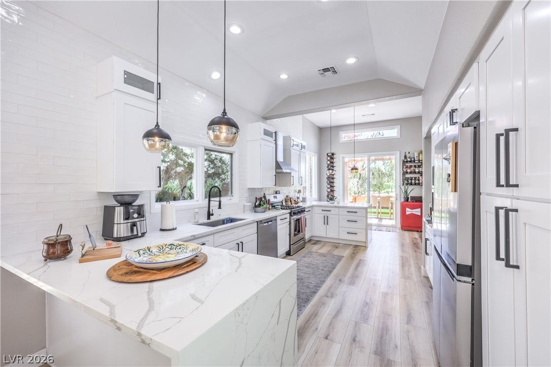 8211 Round Hills Circle, Las Vegas, NV 89113 A pristine culinary space with contemporary finishes and abundant natural illumination invites gourmet creation.