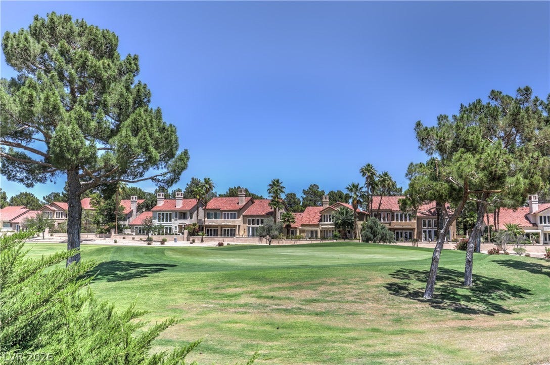 8211 Round Hills Circle, Las Vegas, NV 89113 This tranquil setting offers homes bordering a verdant golf course under a clear, bright sky.