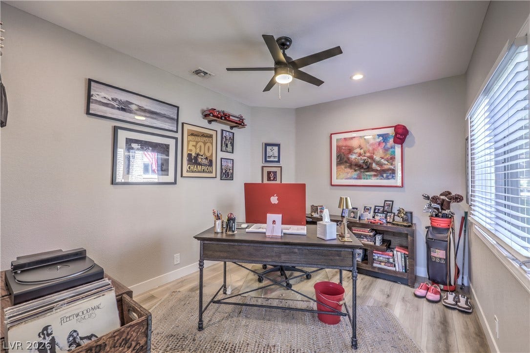 8211 Round Hills Circle, Las Vegas, NV 89113 This versatile home office boasts ample natural light and functional design for productivity.