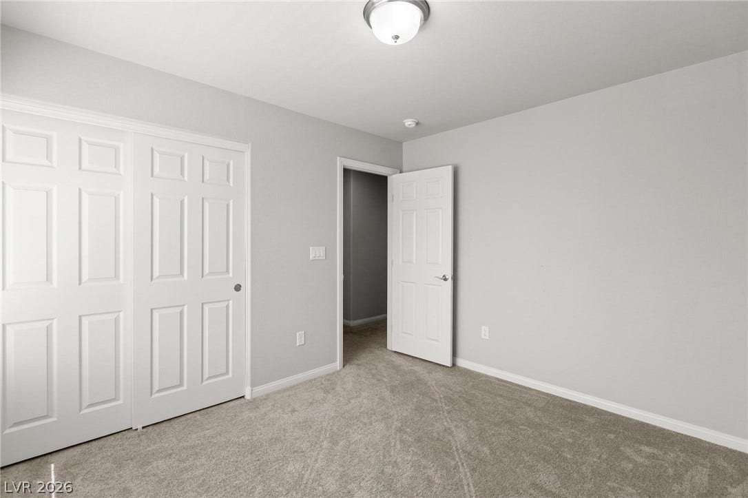 9804 Kodiak Island Court, Las Vegas, NV 89141 Soft carpeting underfoot defines this versatile bedroom with neutral walls and ample closet space.