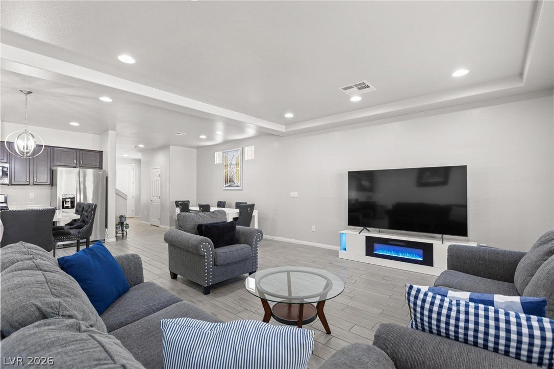 9804 Kodiak Island Court, Las Vegas, NV 89141 An open floorplan seamlessly connects the living space to the dining area and kitchen.