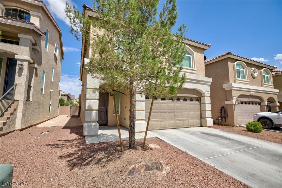 9804 Kodiak Island Court, Las Vegas, NV 89141 Stucco cladding and a tiled roof define the exterior of this two-story home.