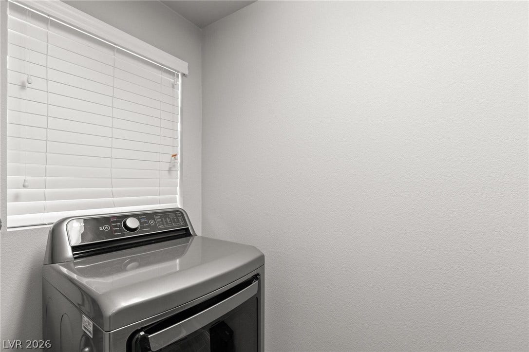 9804 Kodiak Island Court, Las Vegas, NV 89141 Natural light filters through the window in this functional utility space.
