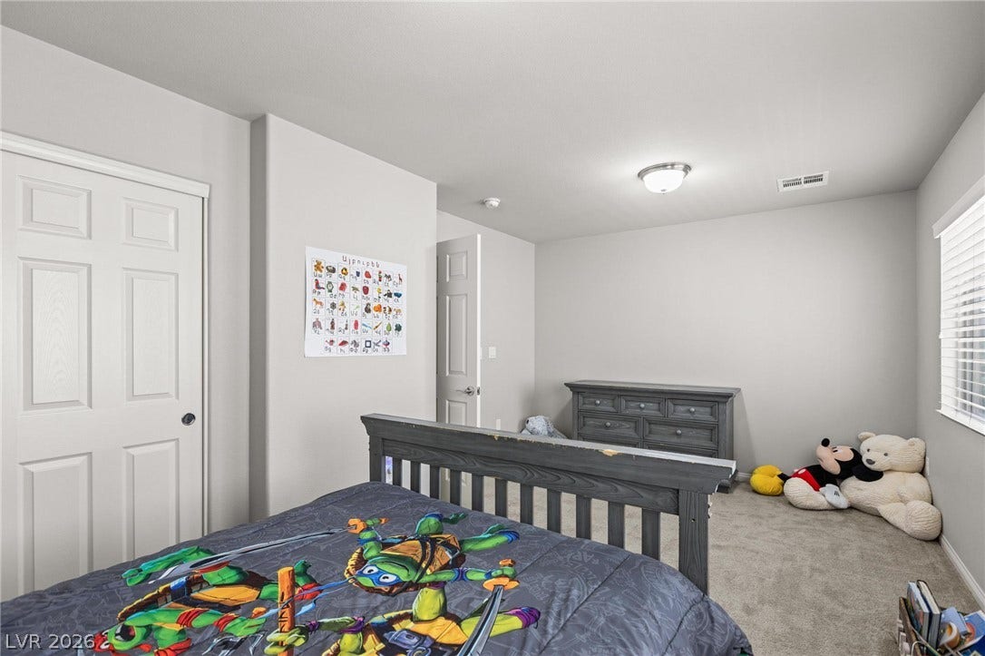9804 Kodiak Island Court, Las Vegas, NV 89141 Smooth walls and plush neutral carpeting define this comfortable secondary bedroom.