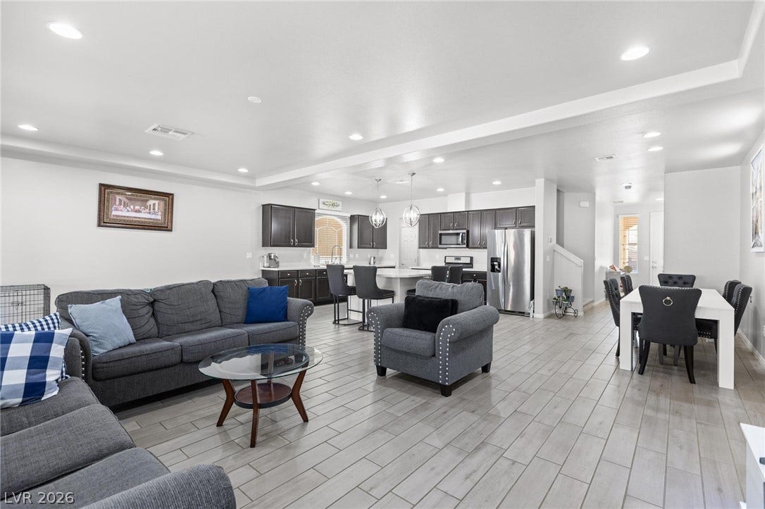 9804 Kodiak Island Court, Las Vegas, NV 89141 Plank tile flooring and recessed lighting flow through this seamless open concept layout.