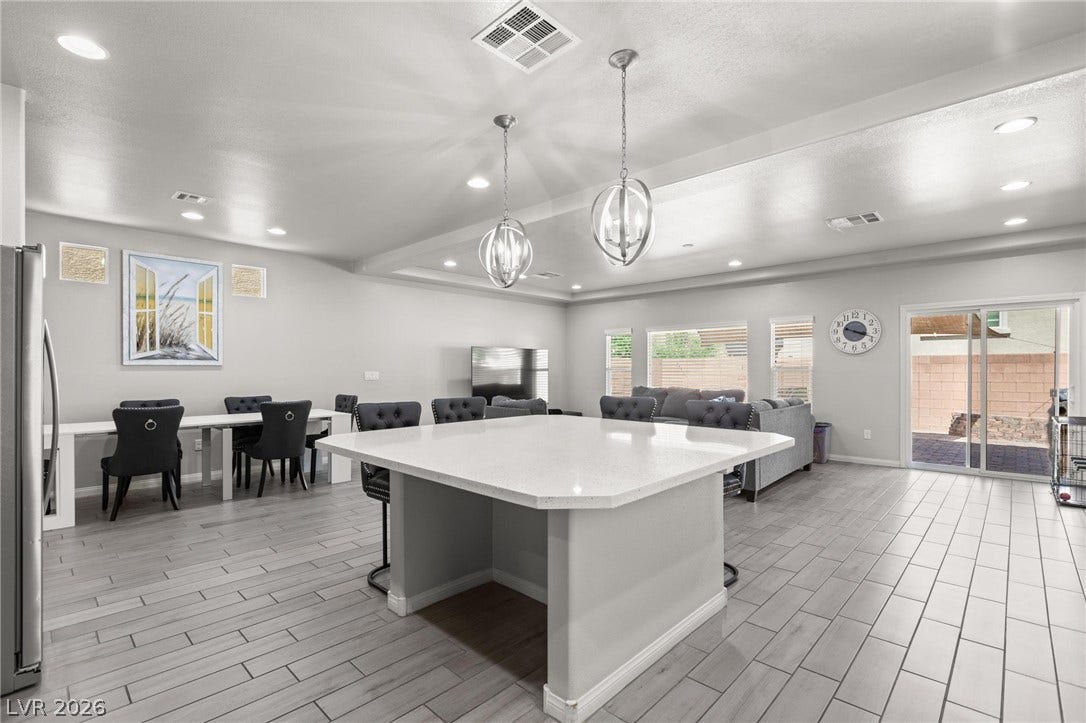 9804 Kodiak Island Court, Las Vegas, NV 89141 An open floorplan design seamlessly connects the modern kitchen and main living spaces.