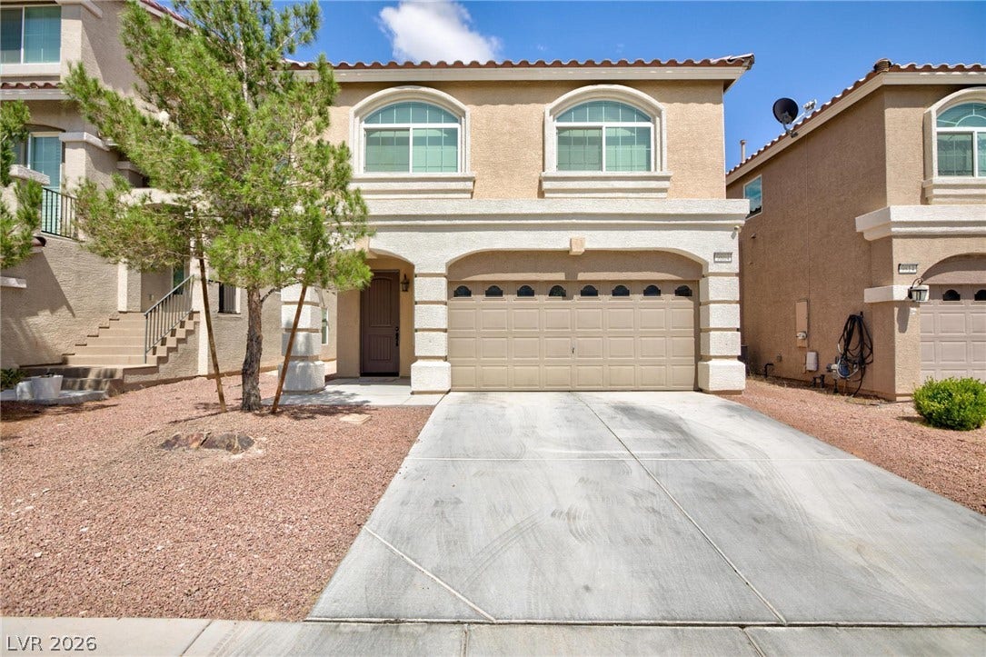 9804 Kodiak Island Court, Las Vegas, NV 89141 Spanish tile rooflines and stucco exterior walls create classic Mediterranean-inspired curb appeal.