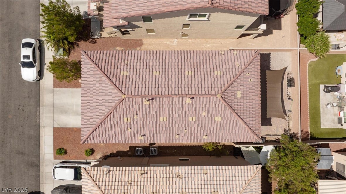 9804 Kodiak Island Court, Las Vegas, NV 89141 An aerial overhead perspective highlights the durable tile roof and the surrounding suburban layout.