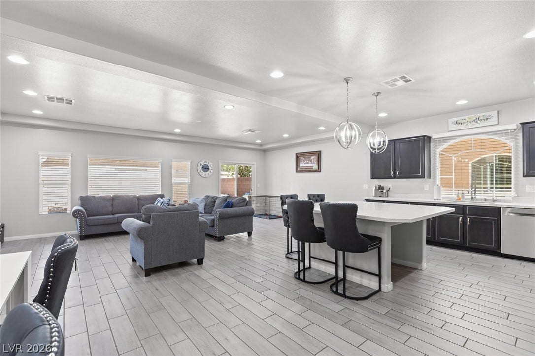 9804 Kodiak Island Court, Las Vegas, NV 89141 An open-concept living area flows seamlessly into a modern kitchen with recessed lighting.
