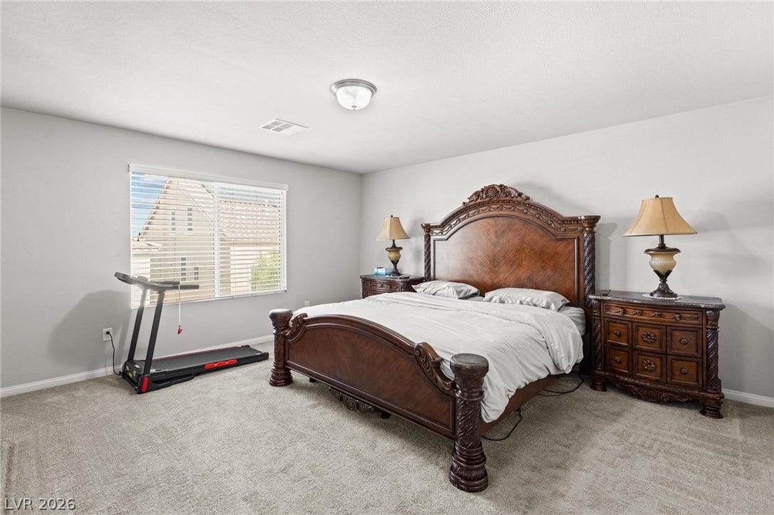 9804 Kodiak Island Court, Las Vegas, NV 89141 Plush carpeting underfoot and a wide window create a comfortable, relaxing atmosphere.