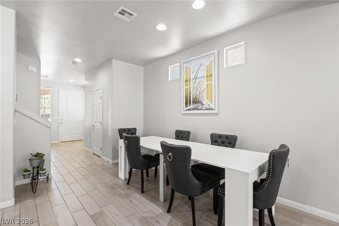 9804 Kodiak Island Court, Las Vegas, NV 89141 Recessed lighting illuminates this versatile dining area featuring tile flooring and clean lines.