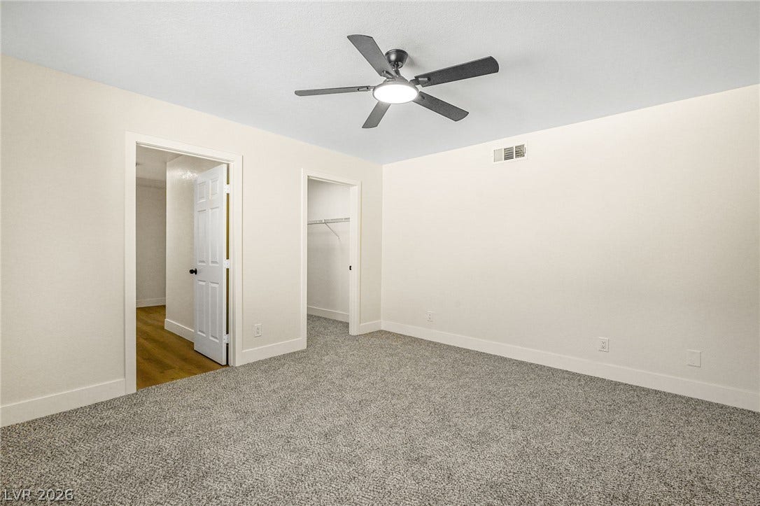 Soft carpeting underfoot defines this comfortable bedroom complete with a walk-in closet.