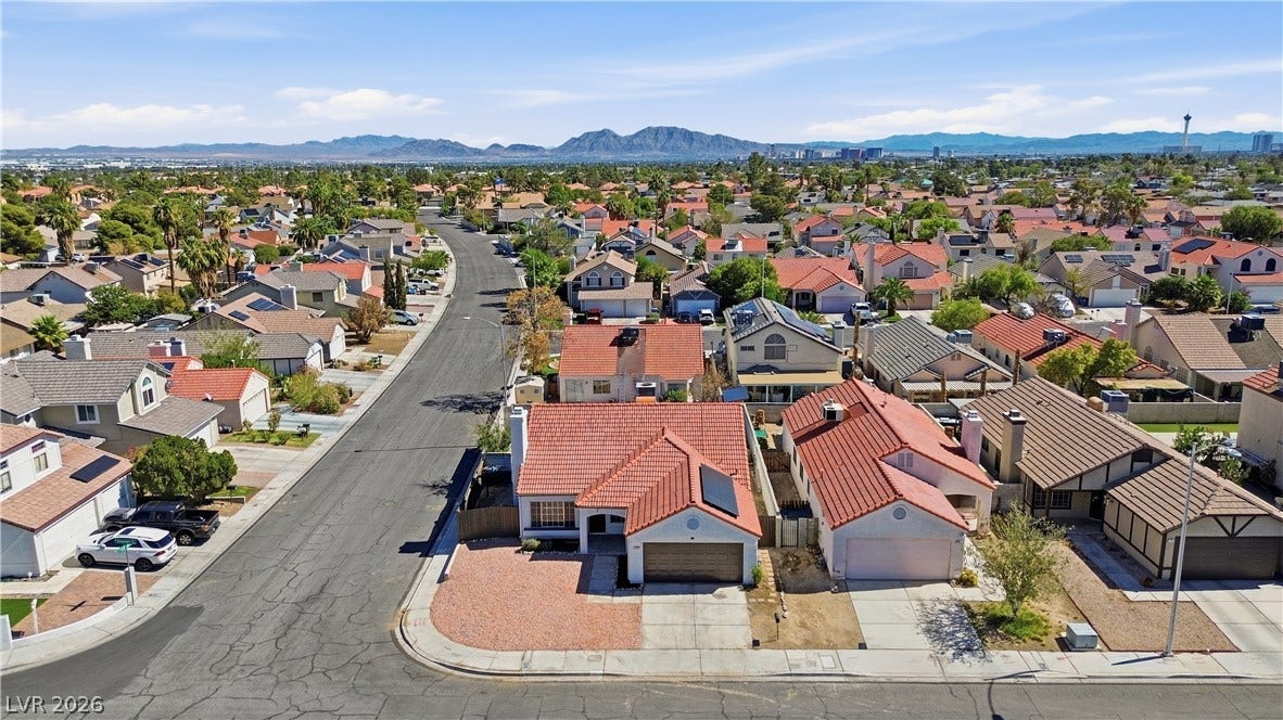 1013 Greystone Drive, Las Vegas, NV 89108 Distant mountain ridges frame this established suburban neighborhood on a clear day.