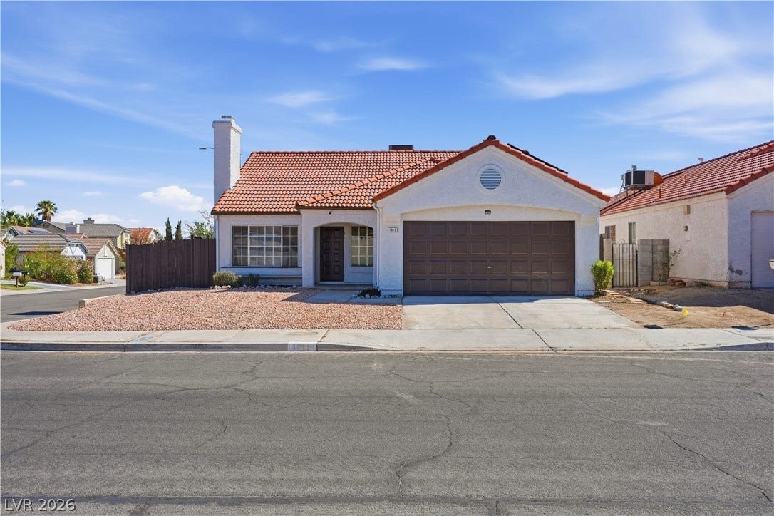 1013 Greystone Drive, Las Vegas, NV 89108 A classic Spanish tile roof and stucco exterior define this charming single-story home.