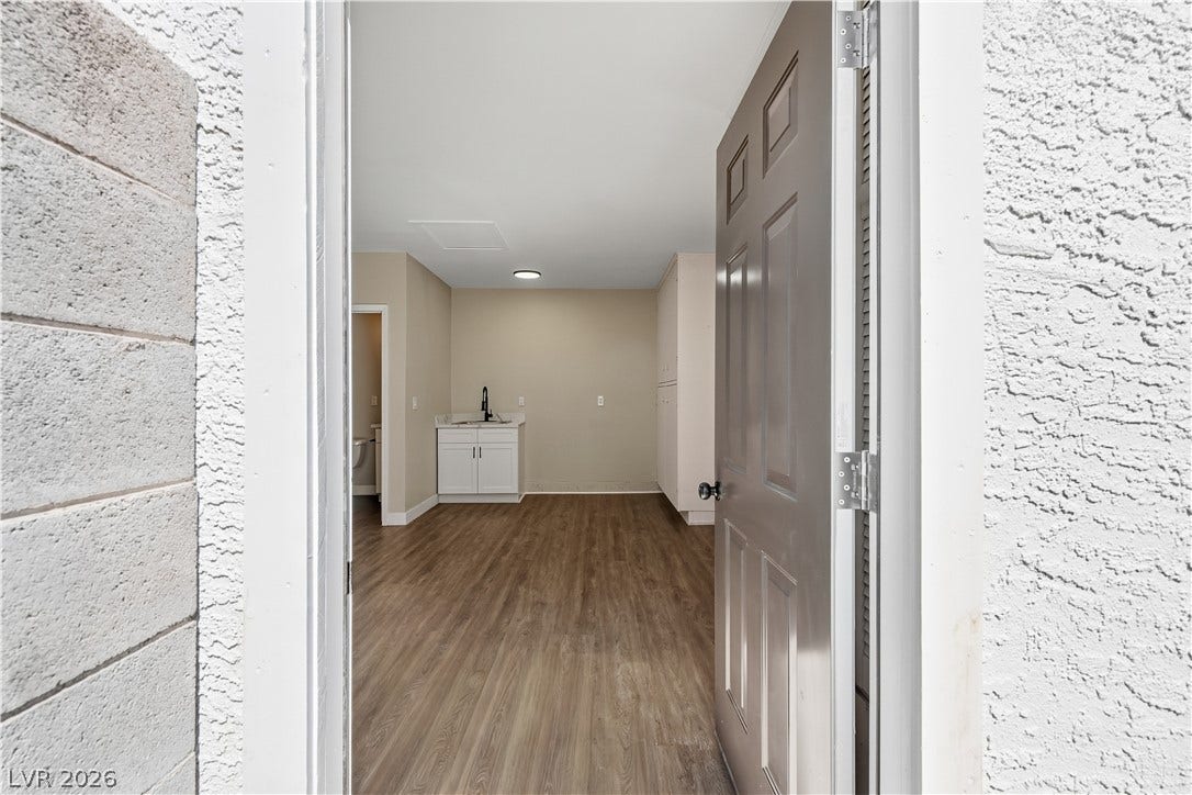 1013 Greystone Drive, Las Vegas, NV 89108 An inviting entryway leads directly into a versatile space with durable wood-look flooring.