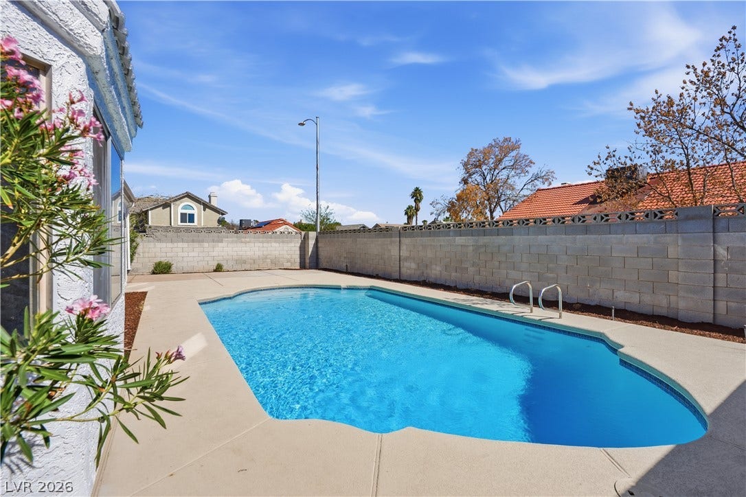 1013 Greystone Drive, Las Vegas, NV 89108 A sparkling in-ground swimming pool highlights this private backyard surrounded by block wall fencing.