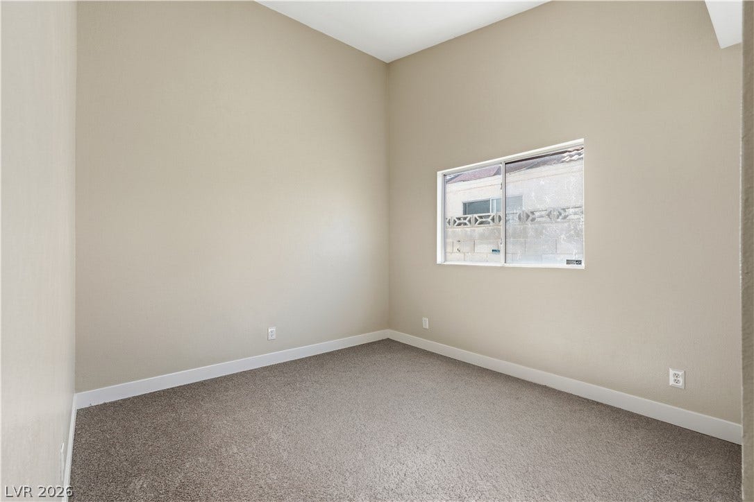 1013 Greystone Drive, Las Vegas, NV 89108 High ceilings and soft carpeting define this versatile, neutral-toned space.