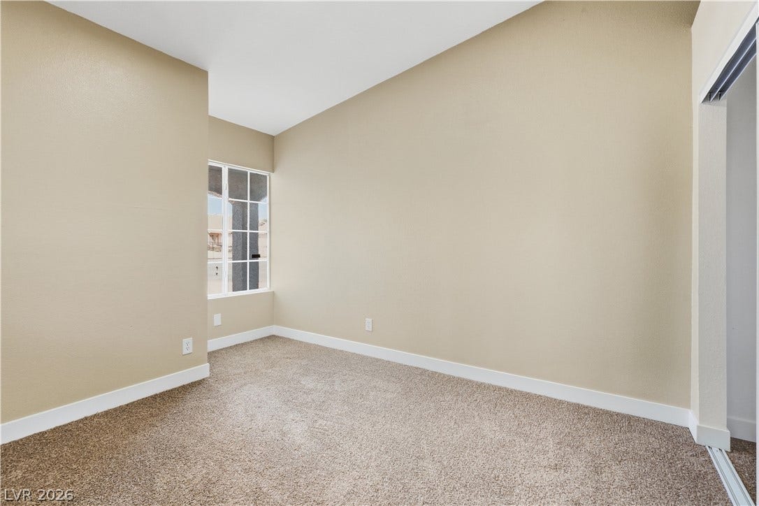1013 Greystone Drive, Las Vegas, NV 89108 Vaulted ceilings and plush carpeting define this versatile secondary bedroom space.