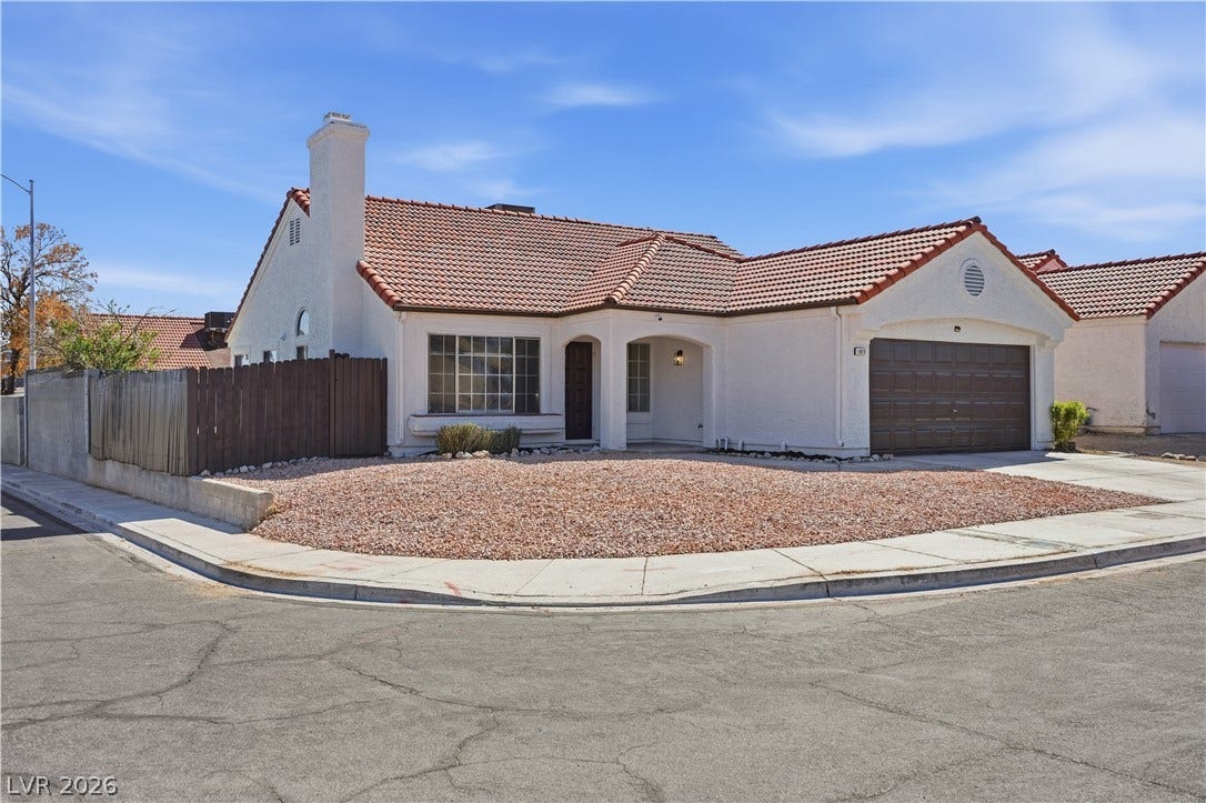 1013 Greystone Drive, Las Vegas, NV 89108 Spanish tile roofing and smooth stucco walls define this classic corner-lot single-family residence.