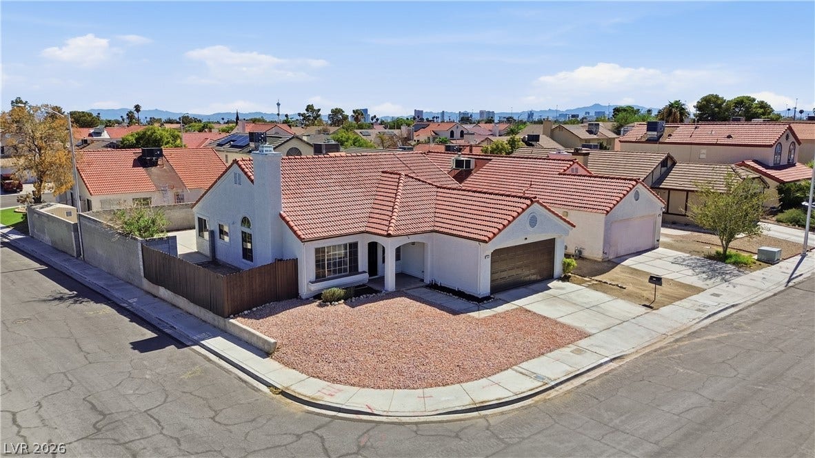 1013 Greystone Drive, Las Vegas, NV 89108 A classic tile roof and low-maintenance front yard highlight this charming corner lot property.