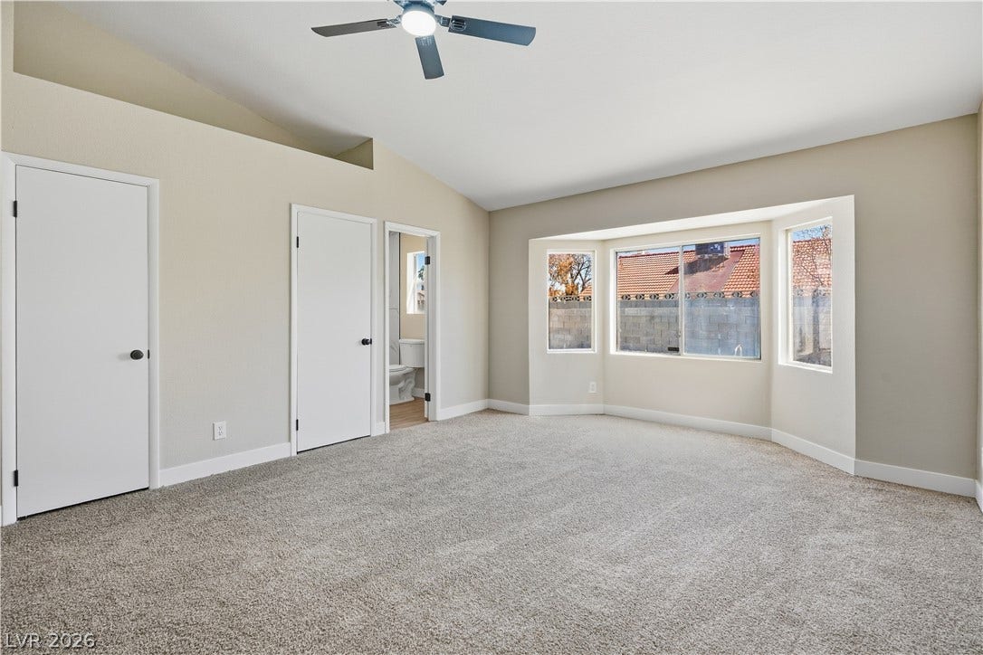 1013 Greystone Drive, Las Vegas, NV 89108 Vaulted ceilings and a large bay window elevate this comfortable primary suite.