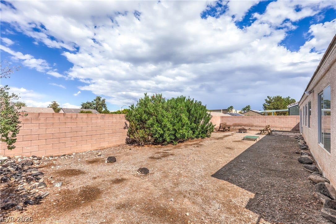 Block walls enclose this low-maintenance yard space.