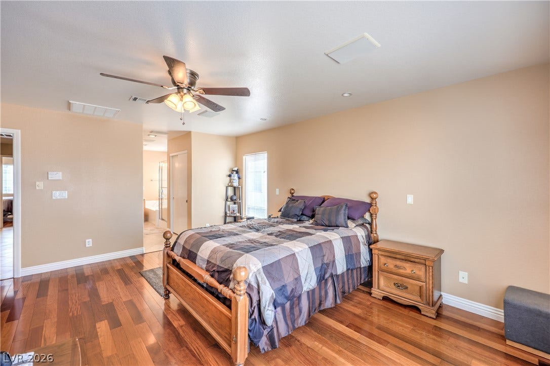 Gleaming wood-laminate floors run throughout this comfortable suite featuring an attached bath.