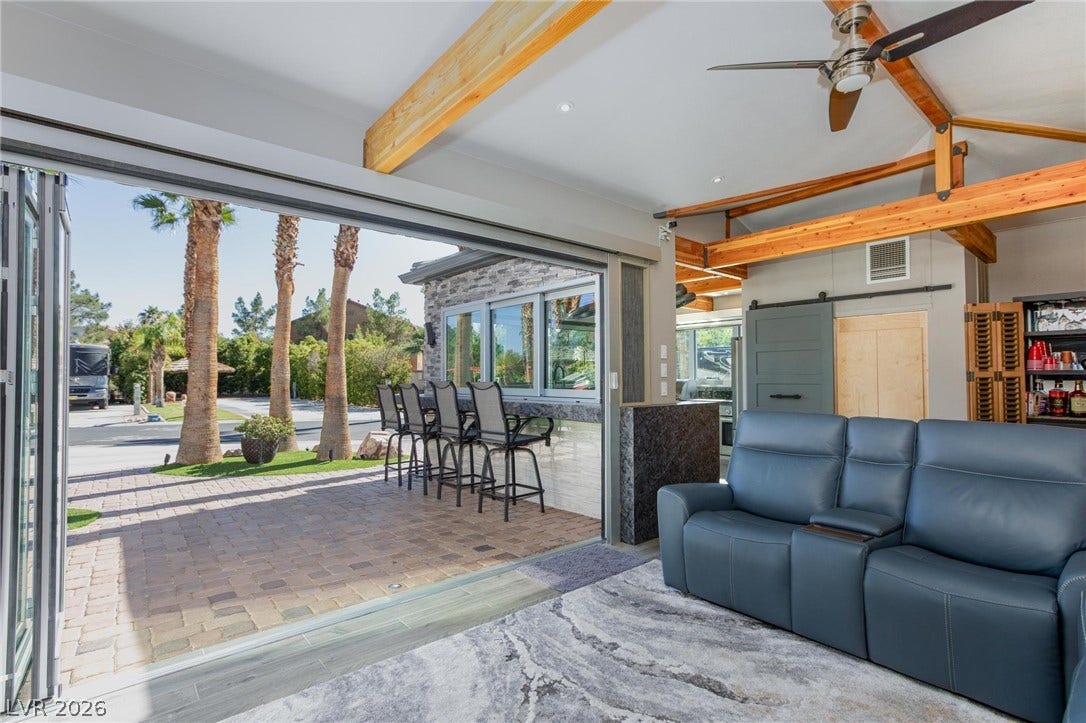 8175 Arville Street, #142, Las Vegas, NV 89139 Exposed wood beams and massive glass folding doors integrate the indoor and outdoor living areas.